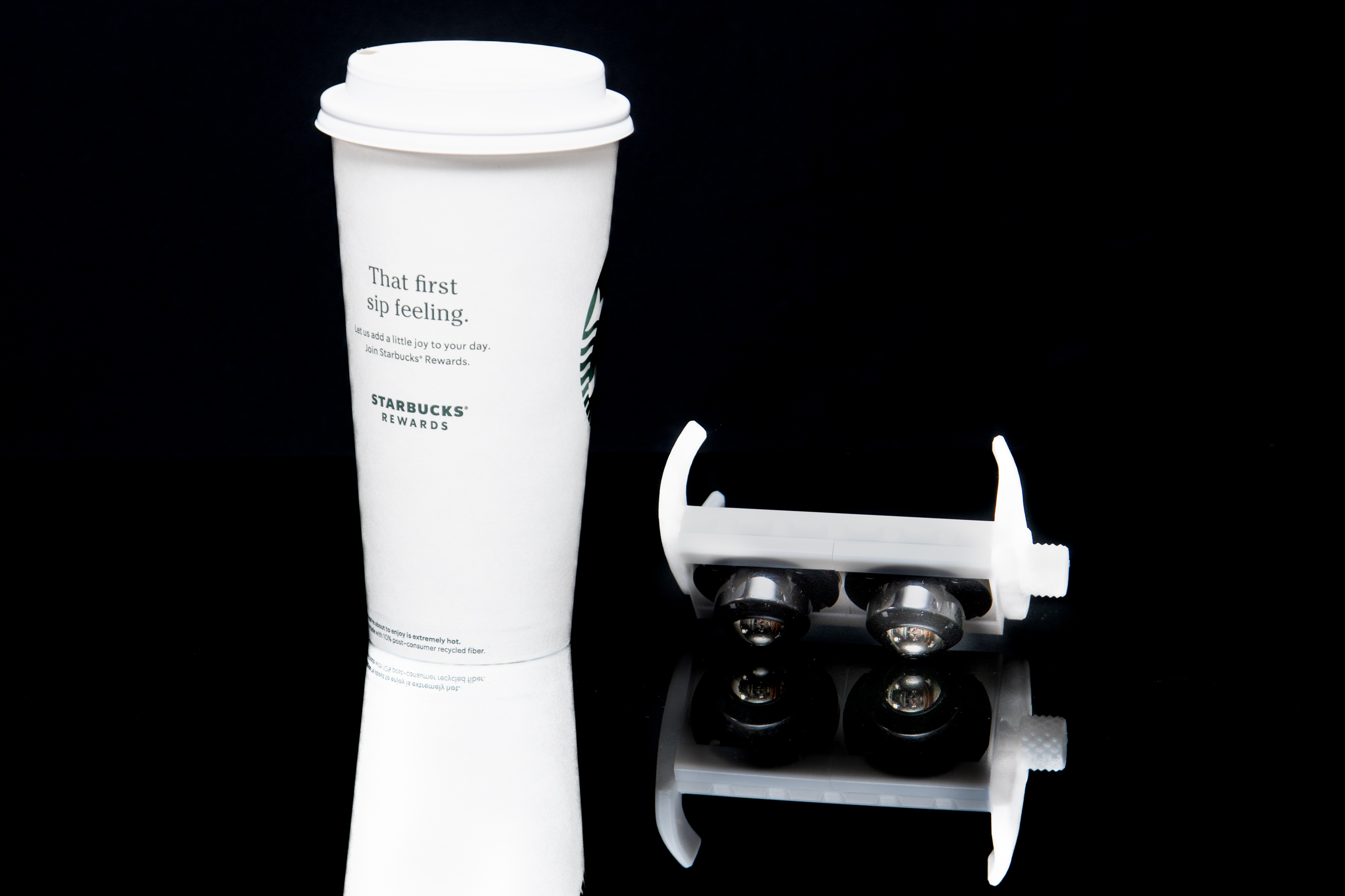 SkyGlider next to Starbucks coffee cup - same price